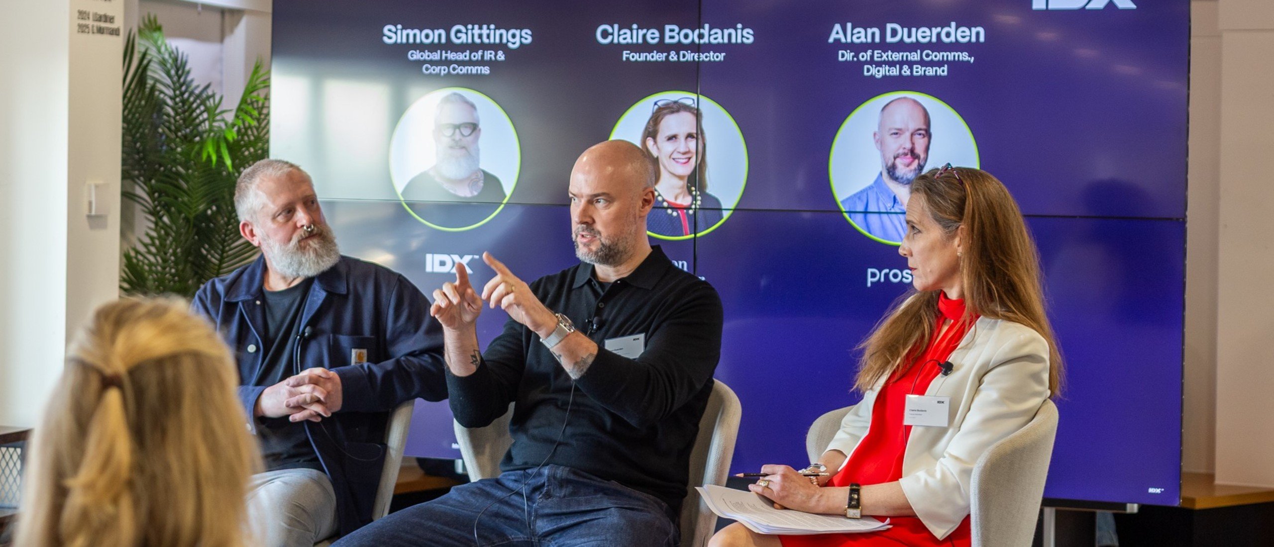 Simon Gittings (left) and Claire Bodanis listen as Alan Duerden explains a point at the breakfast briefing. 