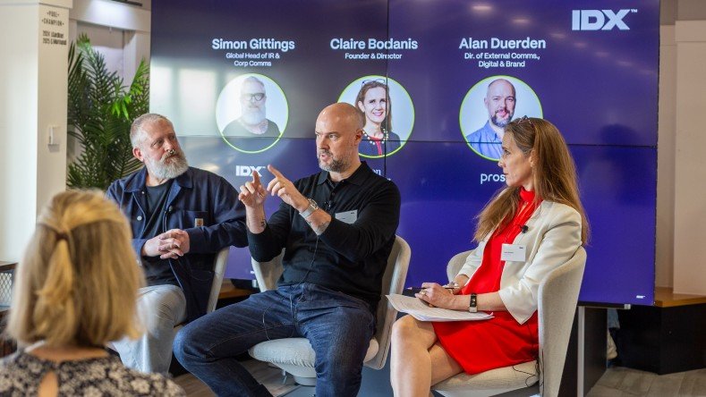 Simon Gittings (left) and Claire Bodanis listen as Alan Duerden explains a point at the breakfast briefing. 