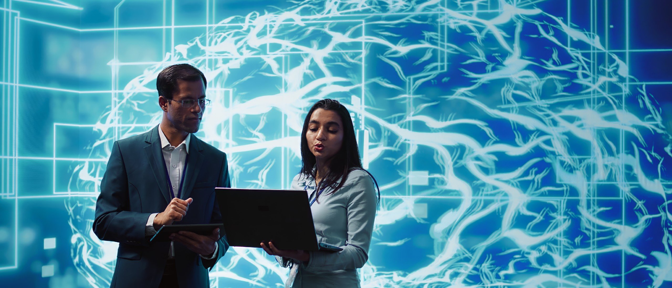A representation of AI behind two businesspeople.