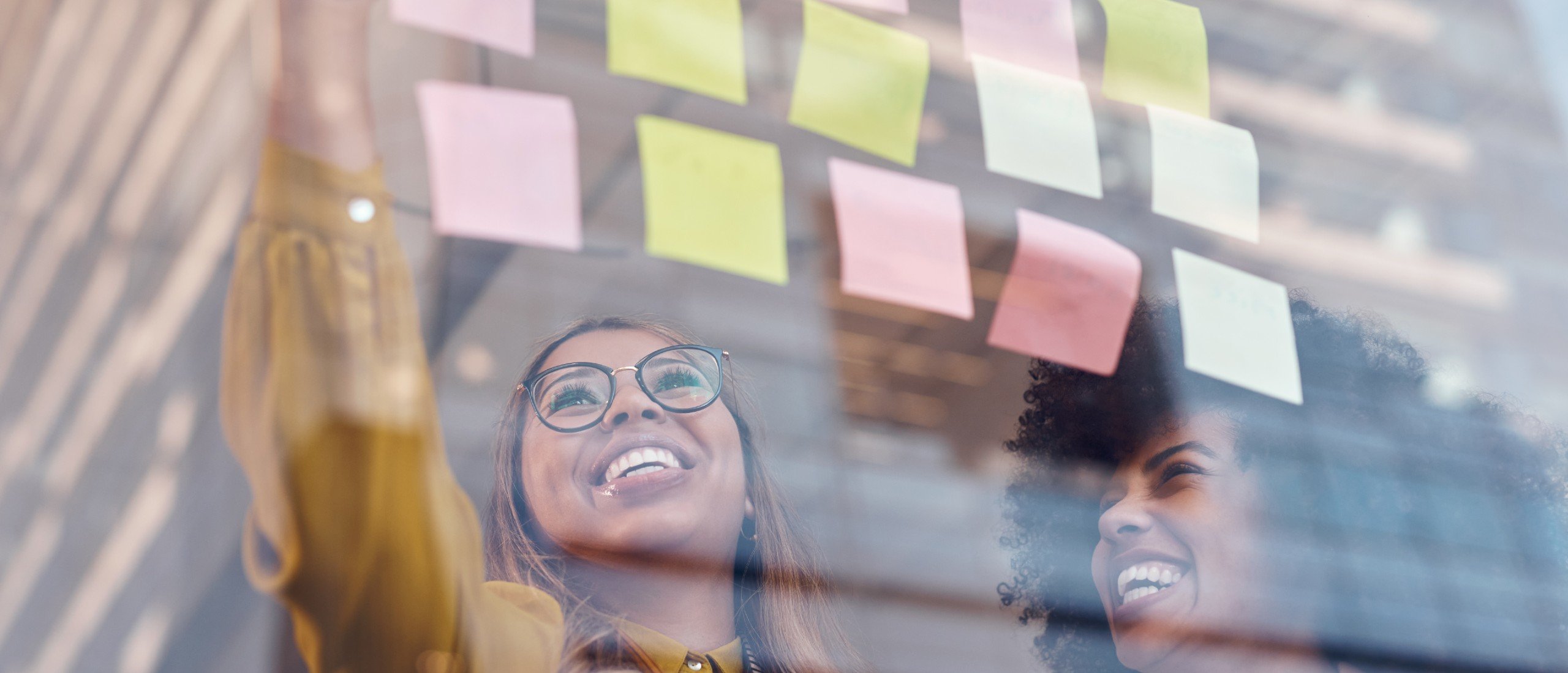 Colleagues work from sticky notes.