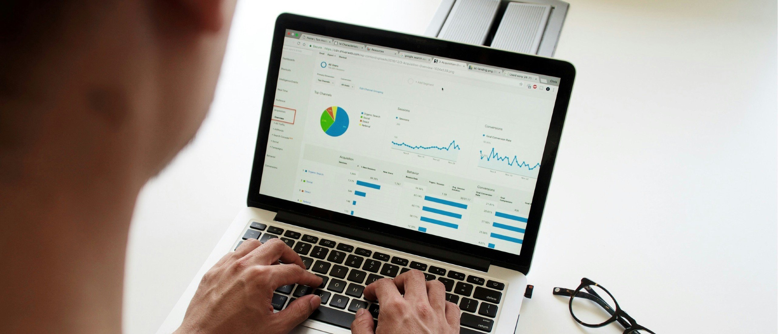 A laptop shows performance analytics.