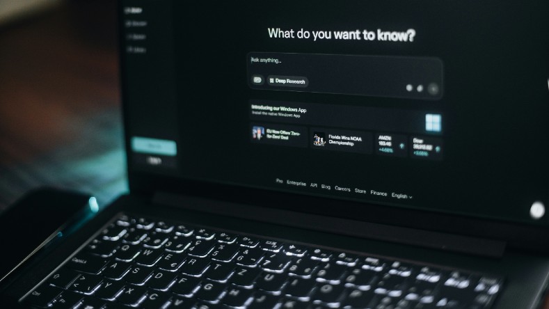 A monitor shows an answer engine prompt.