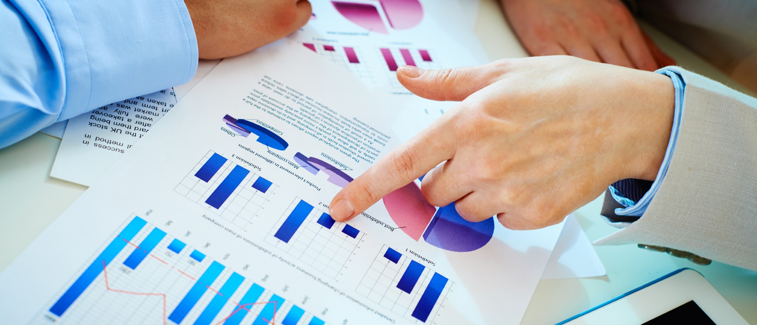 Business people go over research and graphs.