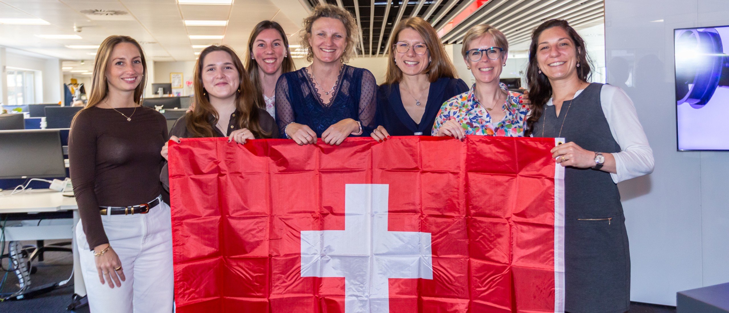 The Geneva team gathers to celebrate.