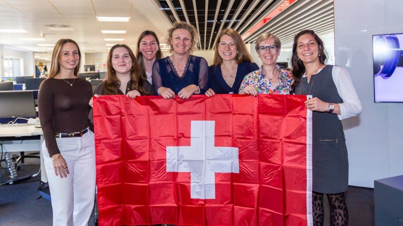 The Geneva team gathers to celebrate.