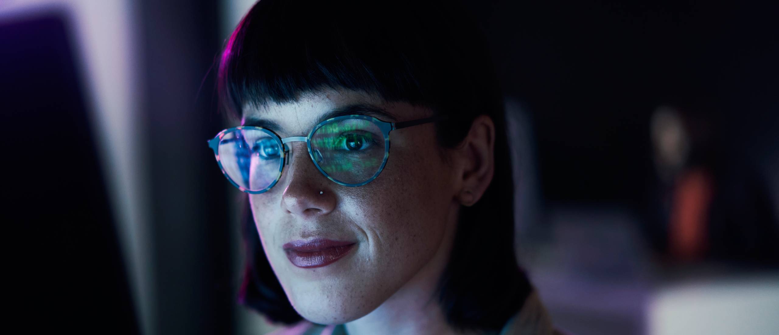 A woman views a computer screen.